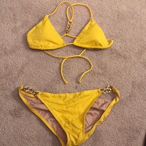 Yellow halter top bikini with gold embellishments